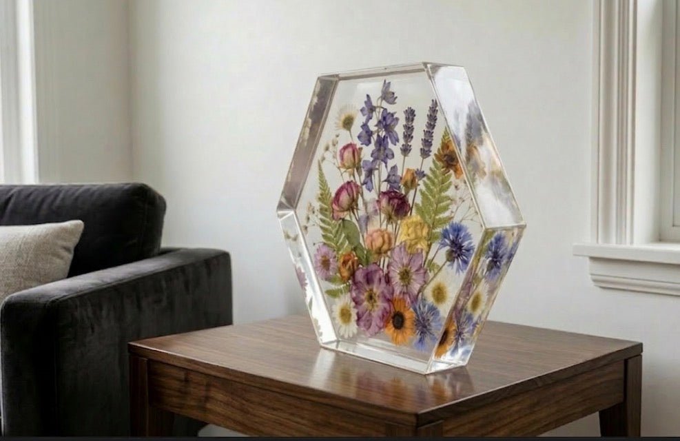 Close up details of vibrant wedding bouquet flowers embedded in crystal clear resin
